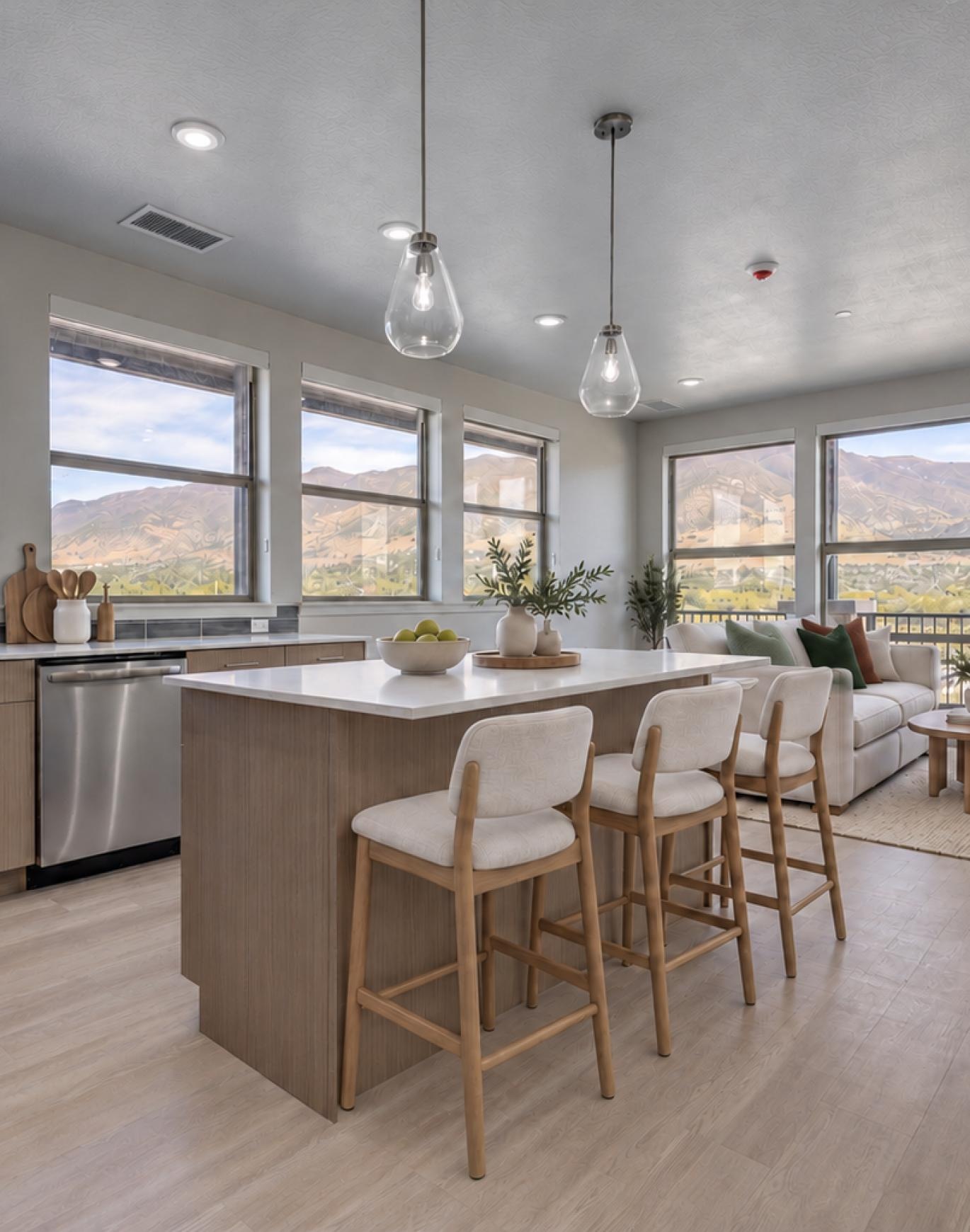 a kitchen with an island and chairs
