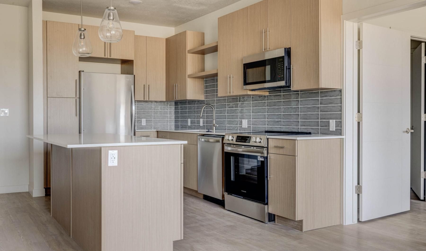 a kitchen with wooden cabinets